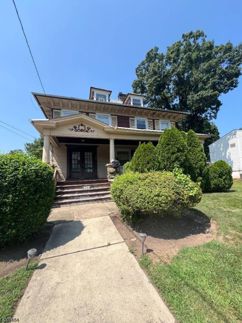 Step back in time with this 2 family home brimming with character and potential.