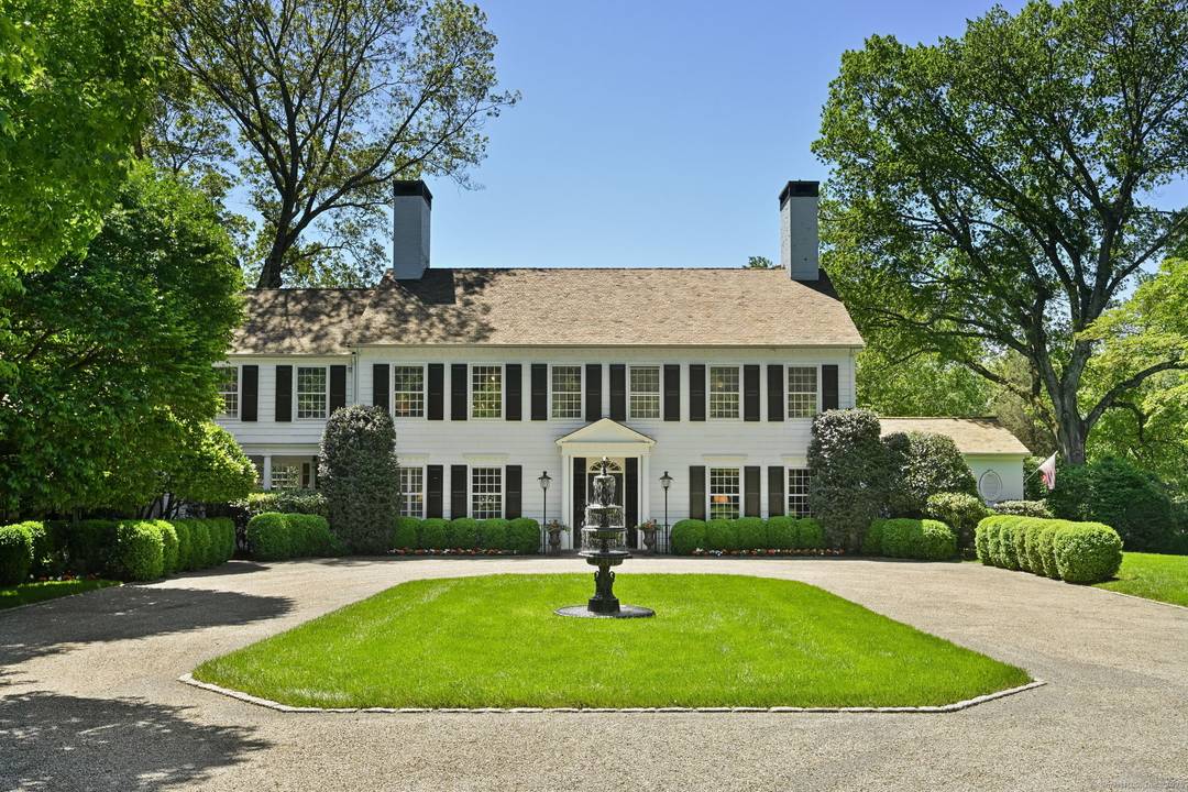 Nestled in one of Connecticut's most sought after estate neighborhoods and just minutes from town, this spectacular 1939 Classic Colonial blends timeless elegance with every modern amenity.