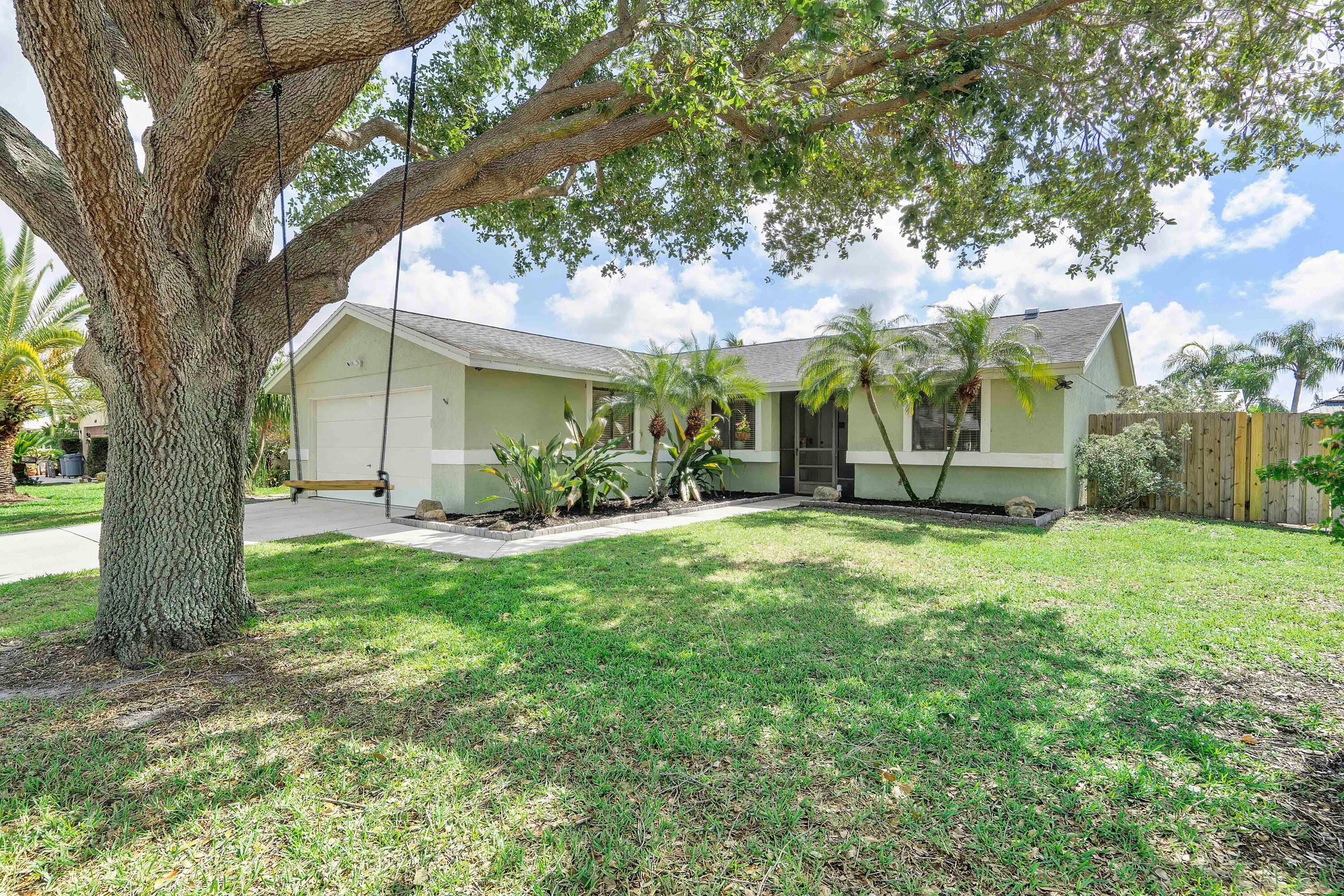 Beautiful three bedroom, two bath single family home located on a spacious corner lot in the sought after Le Chalet community of Boynton Beach.
