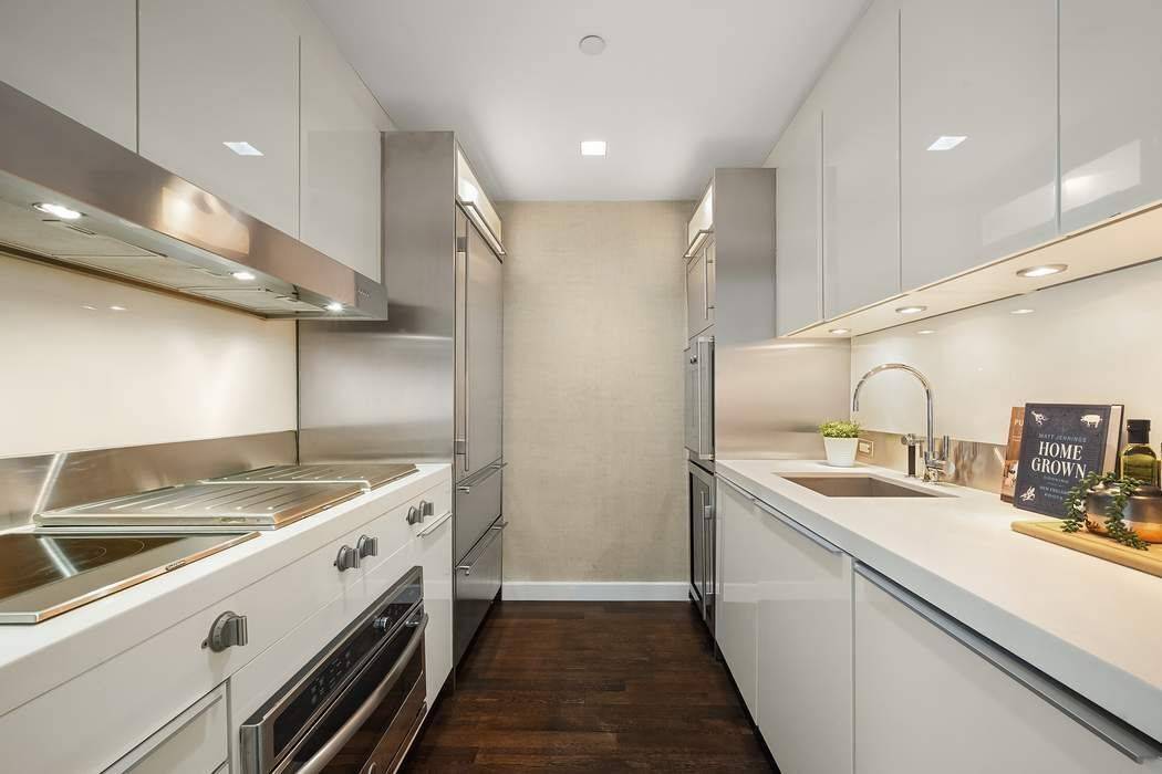 Enjoy the beauty and tranquility of this light filled corner oasis at the luxurious Laurel Condominium !