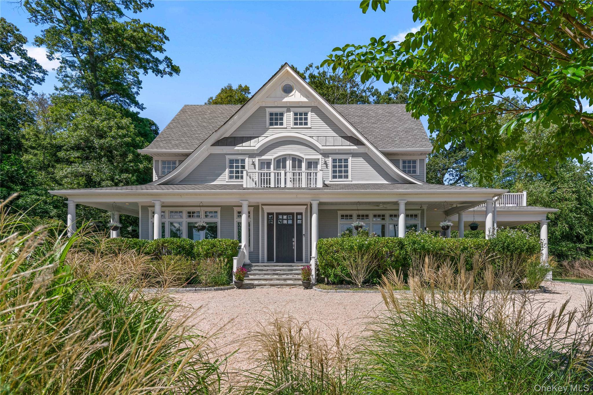 Enjoy spectacular 180 degree water views and timeless Hamptons style at Harbor Lights, a nine year old custom home perched on the shores of Lloyd Harbor.