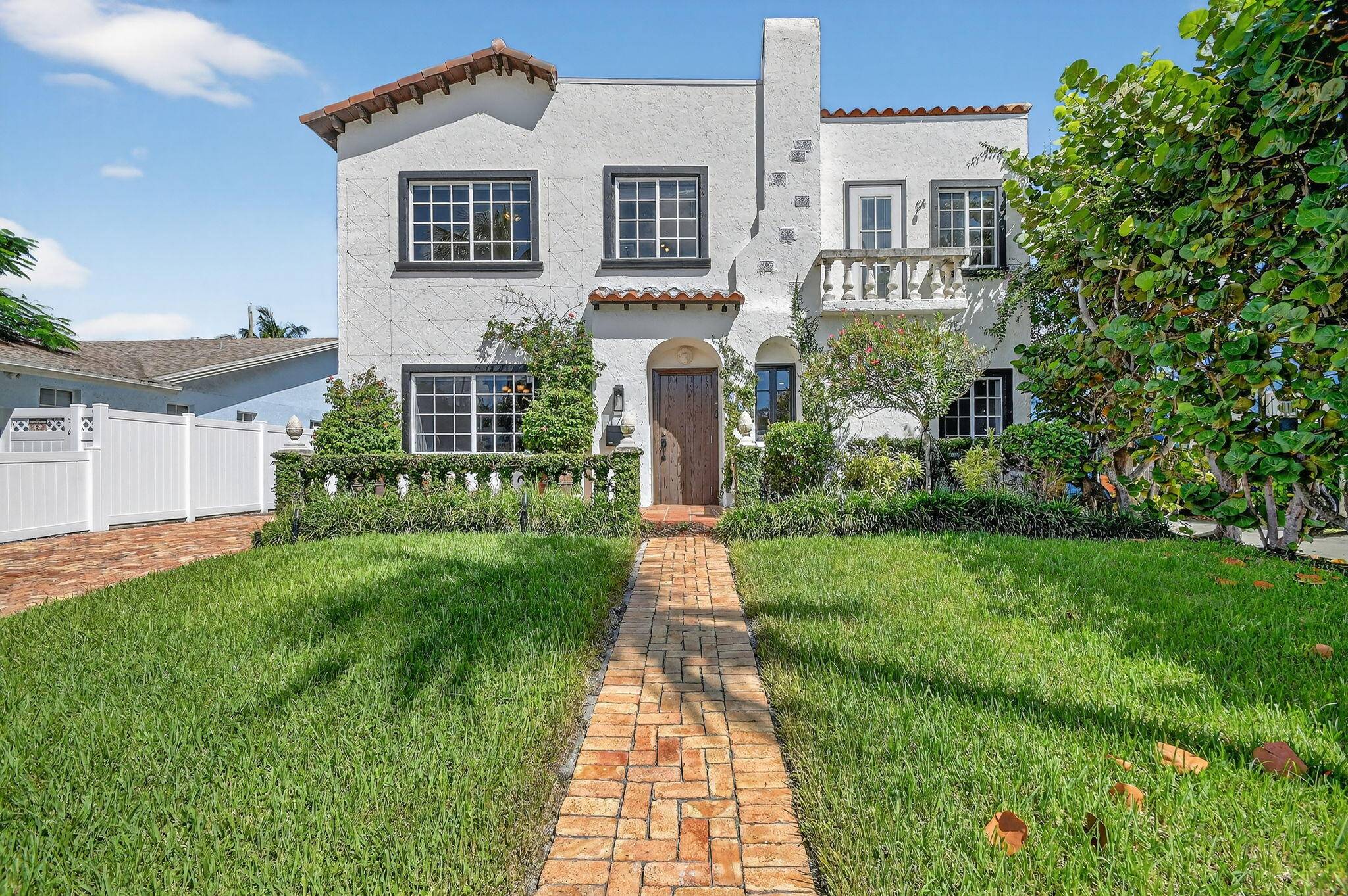 Mediteranean Spanish 4 bedroom, two story home with free form pool located in College Park HIstoric area of Lake Worth Beach.