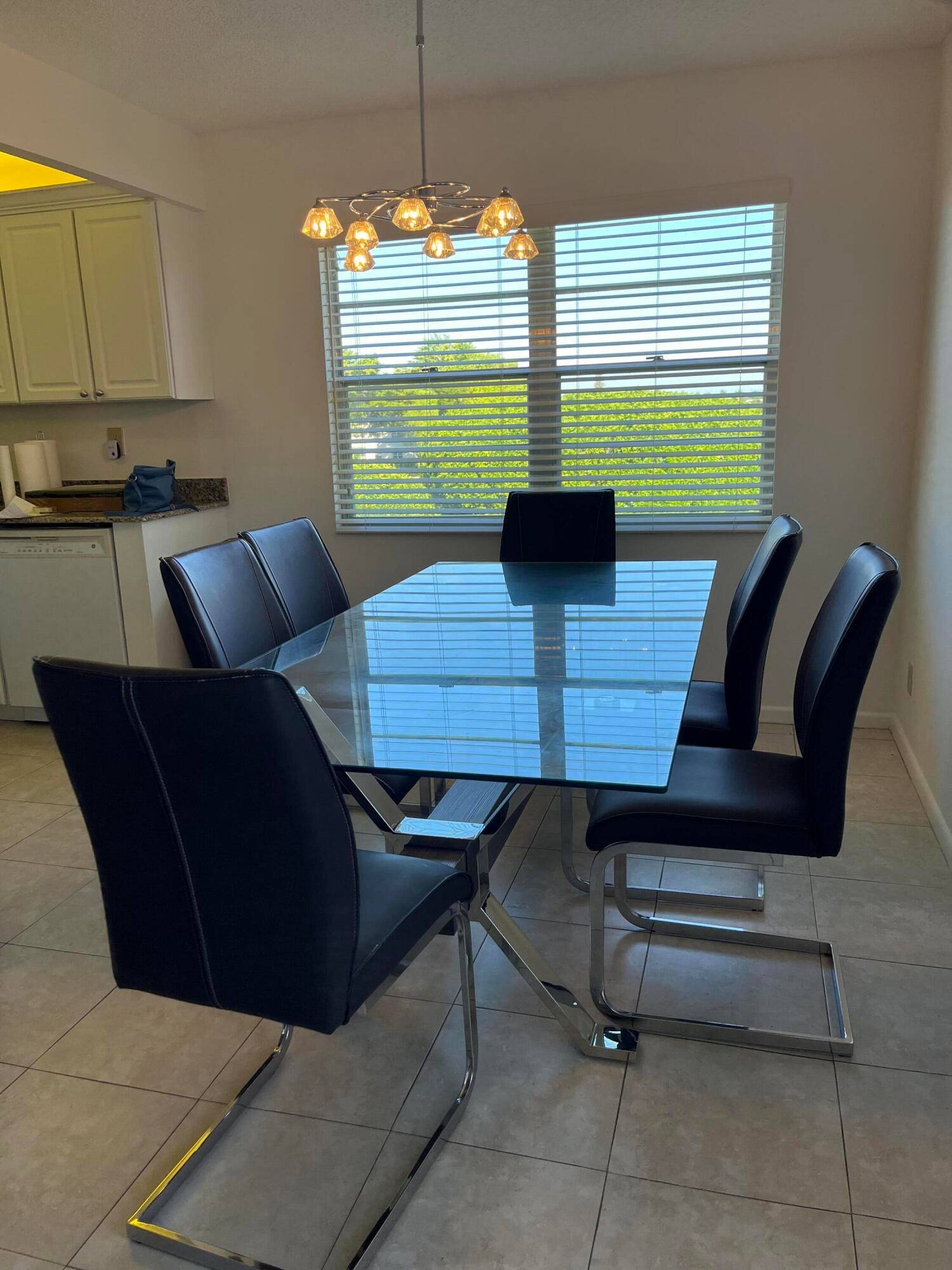 BEAUTIFUL CORNER END CONDO, fully updated with magnificent lake views from enclosed porch.