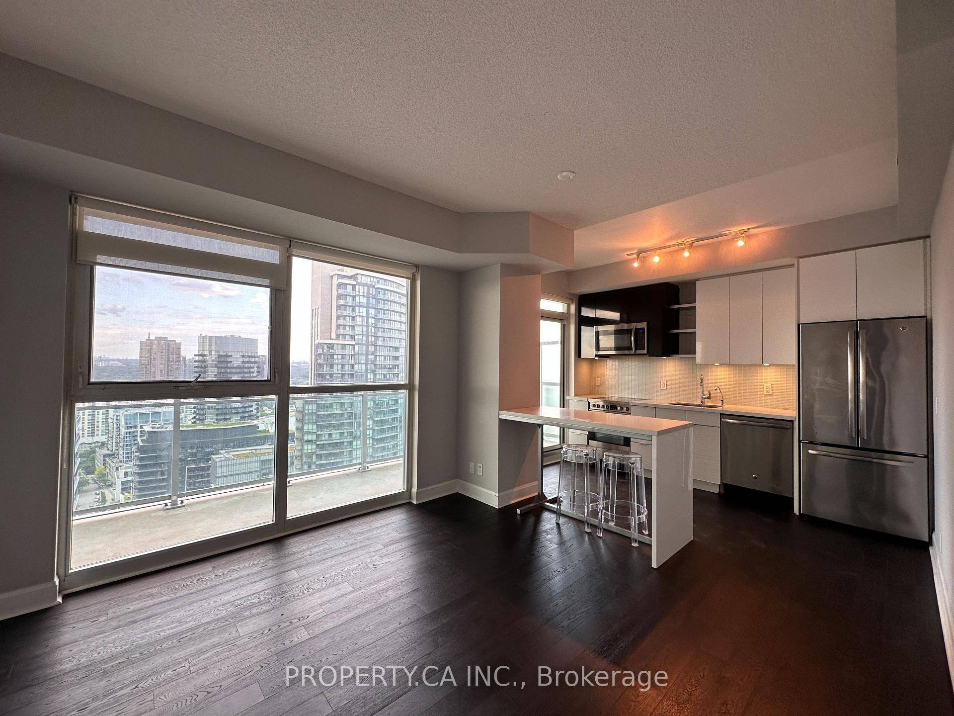 Luxurious Corner Unit with Breathtaking Lake and Skyline View.