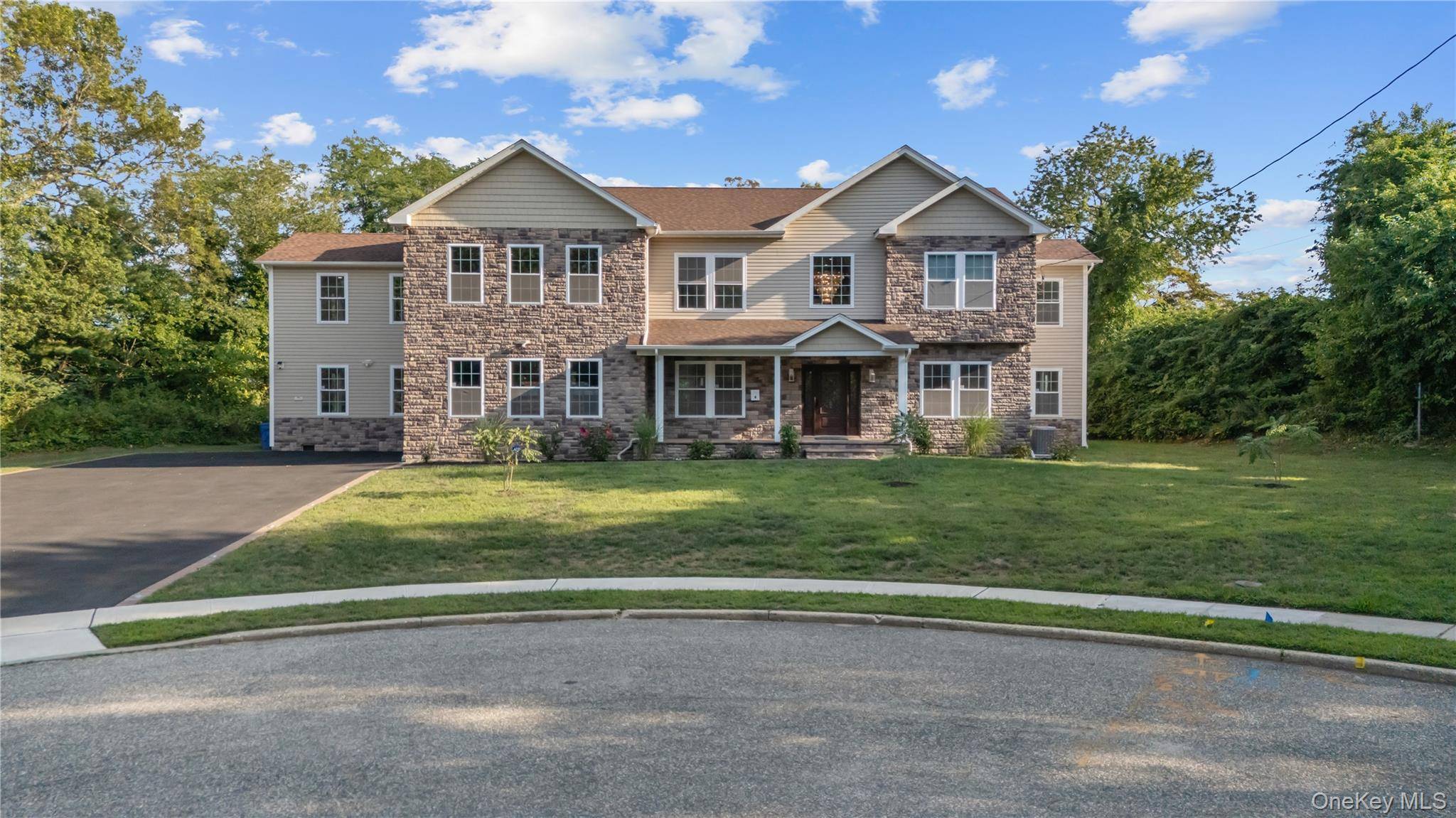 Half Hollow Hills SD Masterpiece Estate New Construction of nearly 6, 000 sq ft on Cul De Sac with 5 Bedrooms, 5 1 2 Baths, 2 Story Foyer, Dining Room, ...