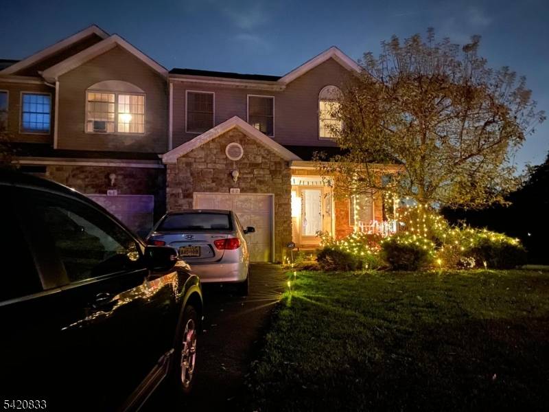 Spacious end unit SYCAMORE model townhome nestled at the end of a quiet cul de sac in the highly desirable Mazdabrook Commons community.