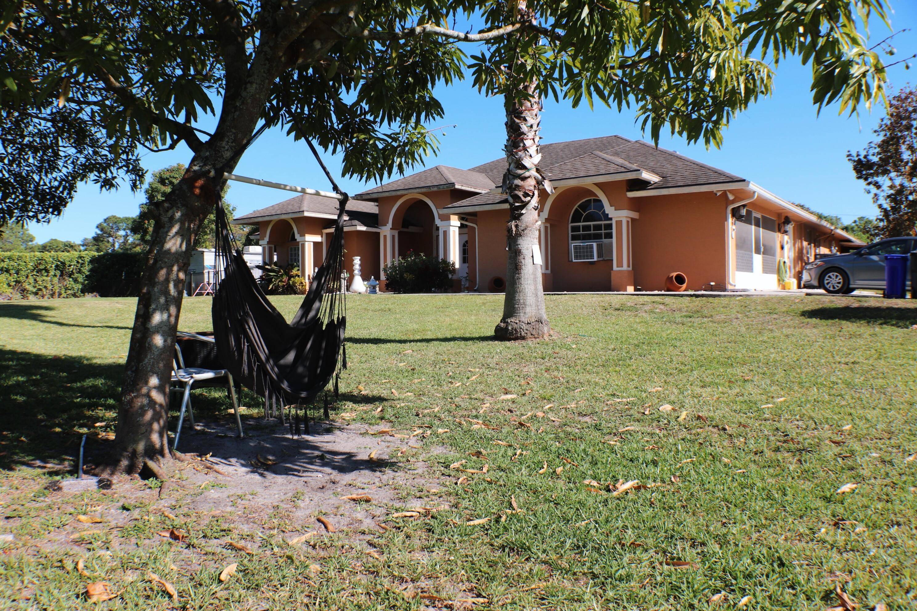 Welcome to your private oasis in the heart of Loxahatchee !