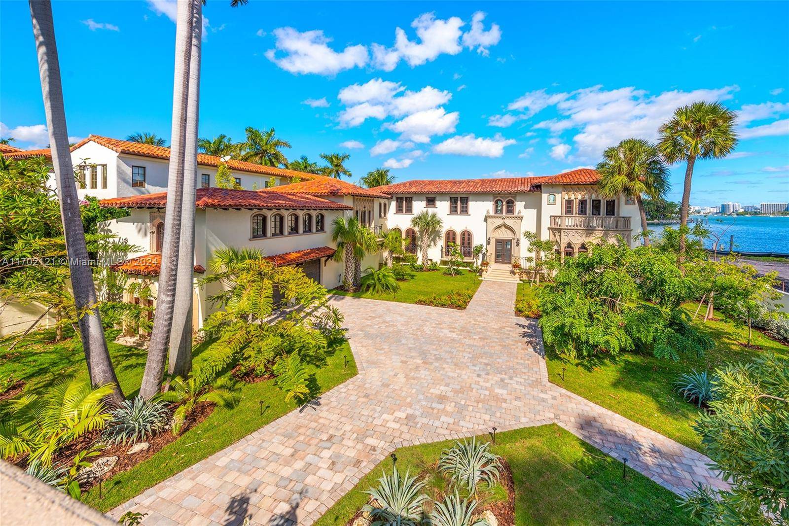 Perfectly nestled in the estates of Palm Island, a Mediterranean marvel with over 15K total SF of living space has been masterfully restored.