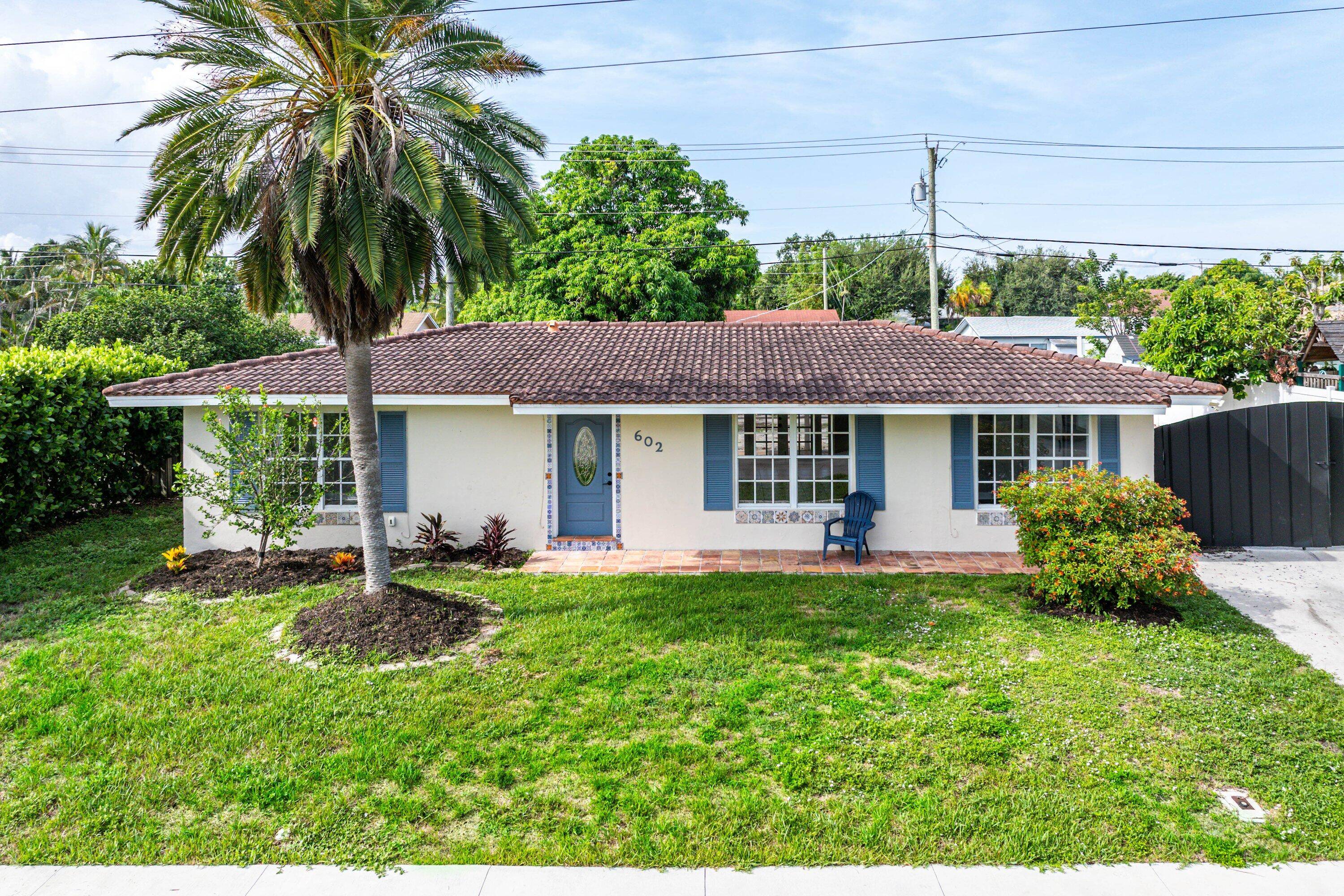 Welcome to your move in ready oasis in the sought after Tropic Palms community of East Delray Beach !