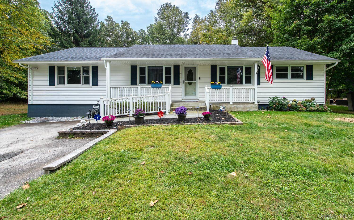 Experience single level living in all its splendor with this beautifully maintained ranch, privately set on 0.