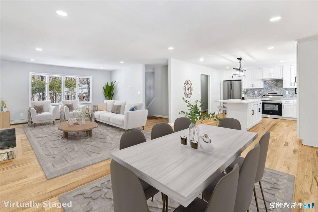 This stunning remodeled brick Raised Ranch with a 2 car garage and 3 spacious bedrooms, including a primary suite with a brand new en suite bath is convenient to everything ...