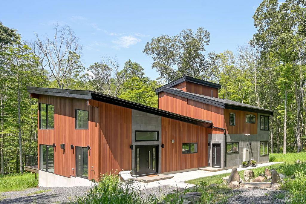 Discover minimalist modern luxury in this stunning new contemporary home, set on an expansive 7.