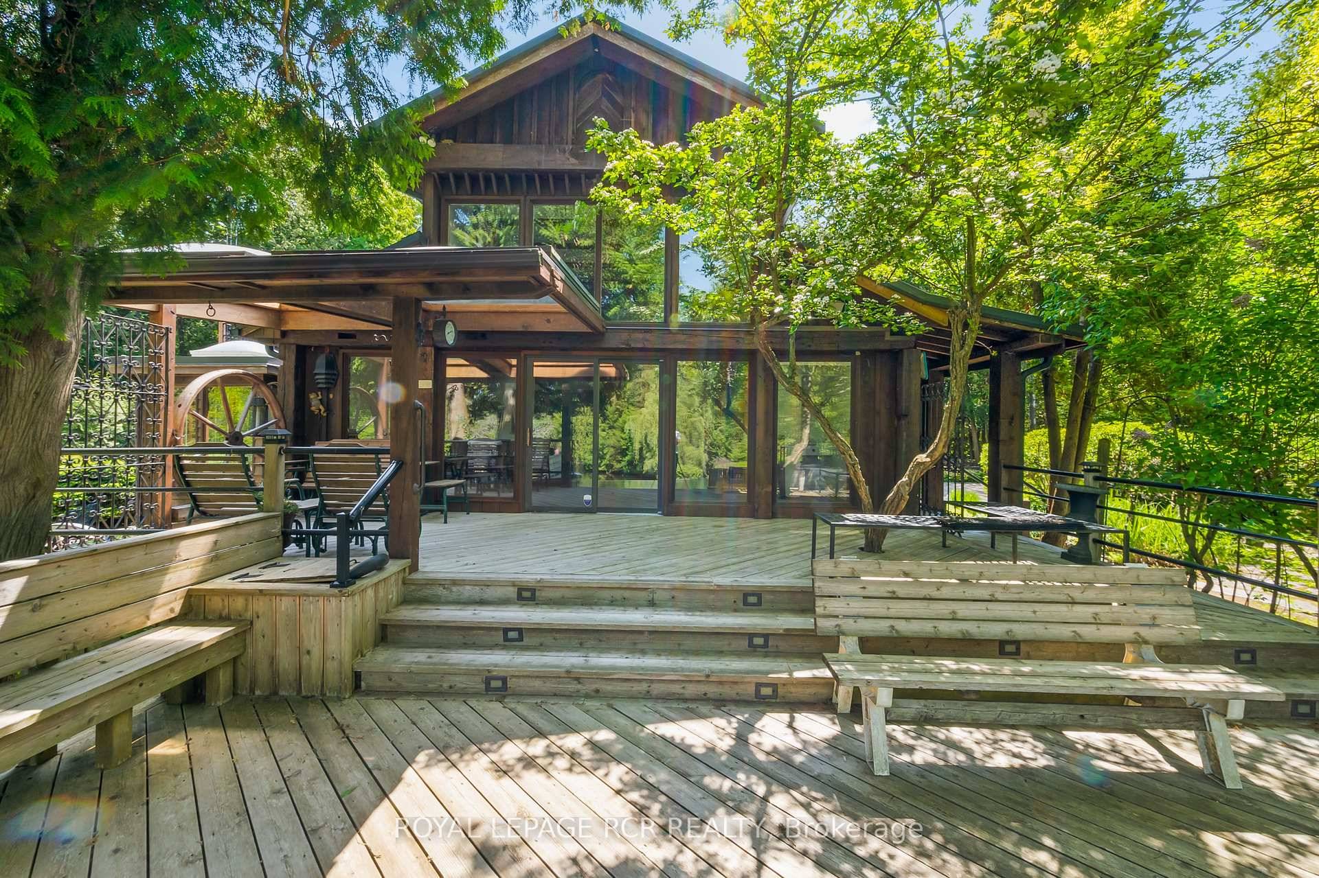 Tucked away on a secluded road, 15 River Bluff Path offers an extraordinary sanctuary blending natural beauty, creative energy, and quiet seclusion.