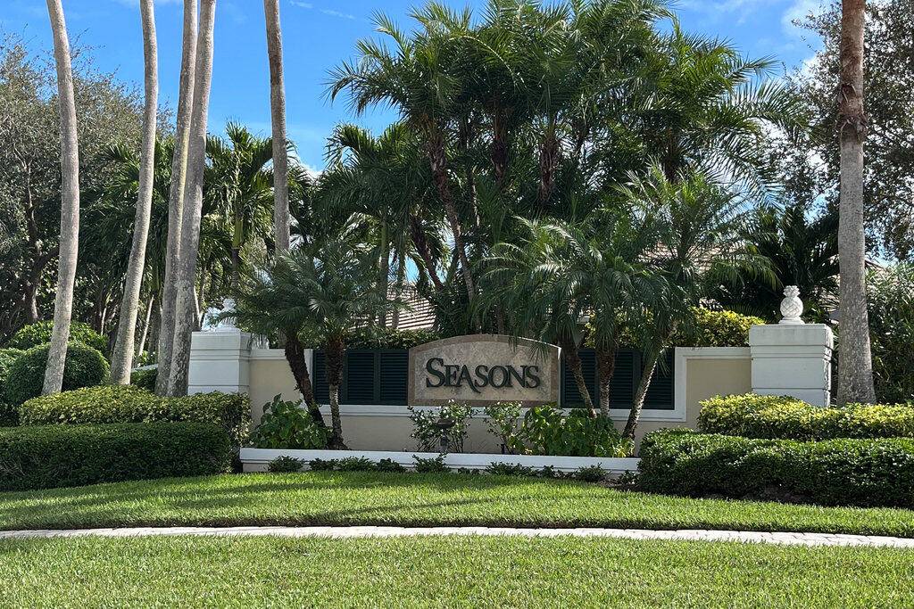 This beautiful courtyard home is located in the Seasons gated community.