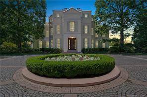 This magnificent estate was designed by renowned architect Roger Ferris and boasts 5 levels of living with spectacular water vistas of Southport Harbor.