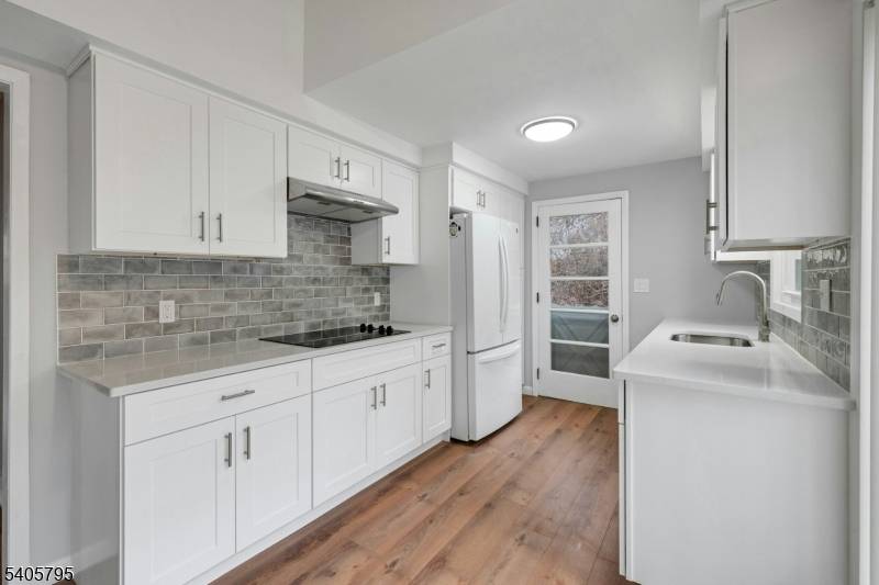 Welcome home to this updated bi level featuring 3 bedrooms, 2 full baths, and a 2 car garage, HW flooring, wood burning fireplace, large windows with plenty of natural light, ...