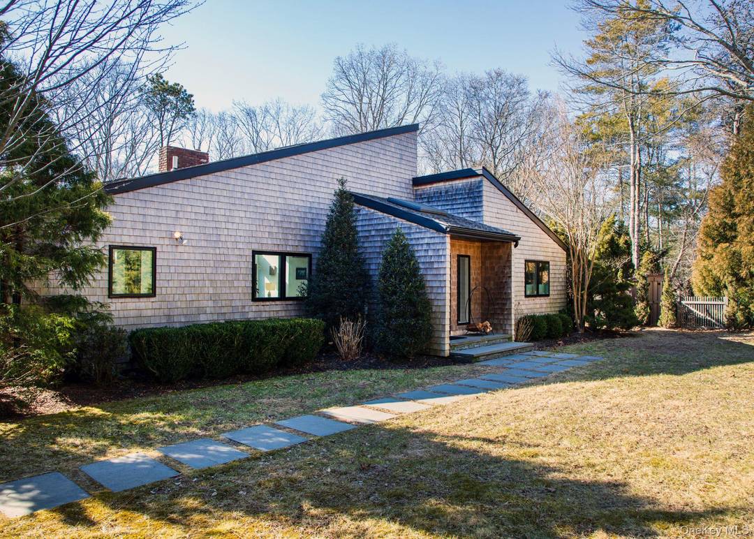 Welcome to Quogue ! This chic, inviting home is tucked away down a long drive on a beautifully landscaped property.