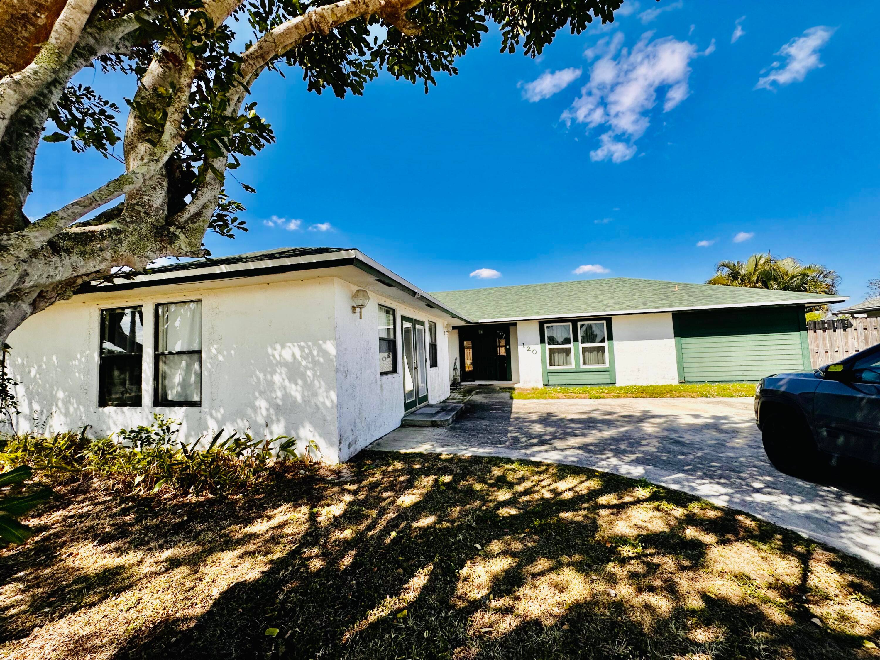 Discover modern living in the heart of Royal Palm Beach with this exquisite stylish 4 bedroom two family home with New AC, Roof Solar panel.