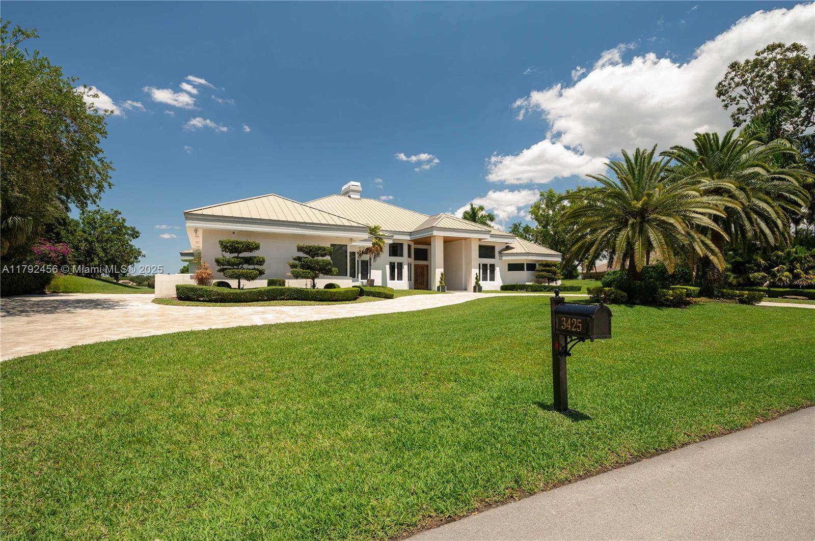 A rare masterpiece in Weston s prestigious Windmill Ranch Estates.