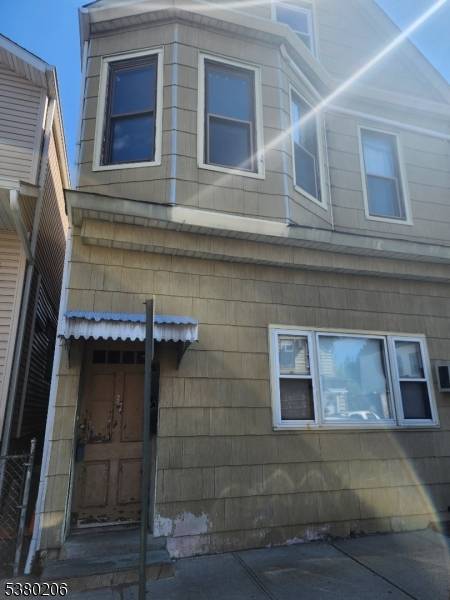 Great investment. First Fl is 5 rooms with 2 BRs, 1 BA and laundry room and needs updating ; 2 ND Fl has 3 BRs plus Kit, LR and 1.