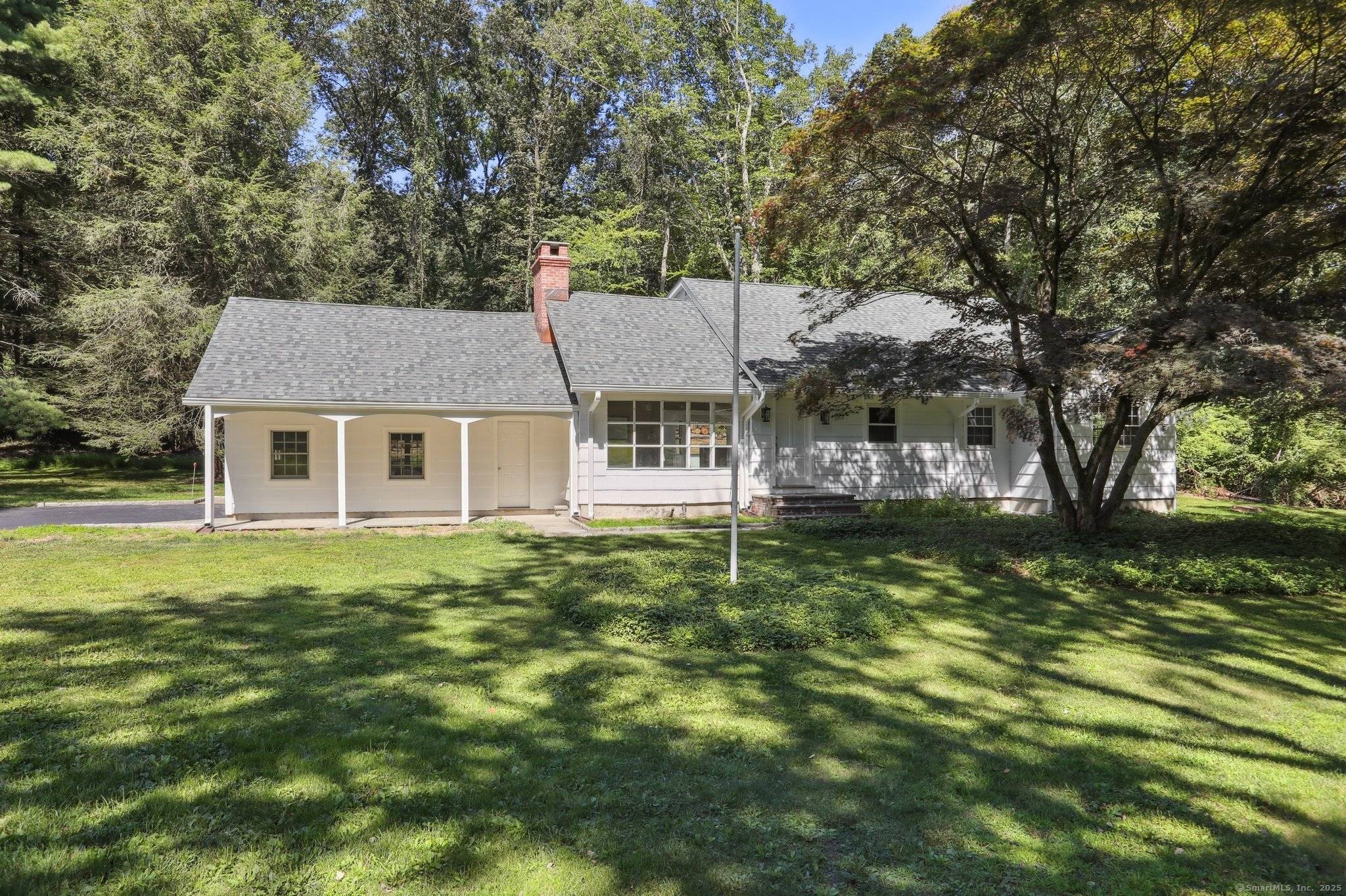Beautiful Cape Cod style home set on a desirable, tree lined street in a prime location.