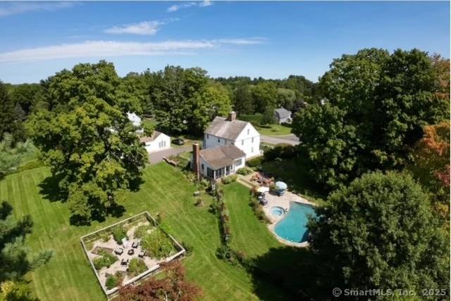 This extraordinary center chimney colonial blends rich history with modern elegance.