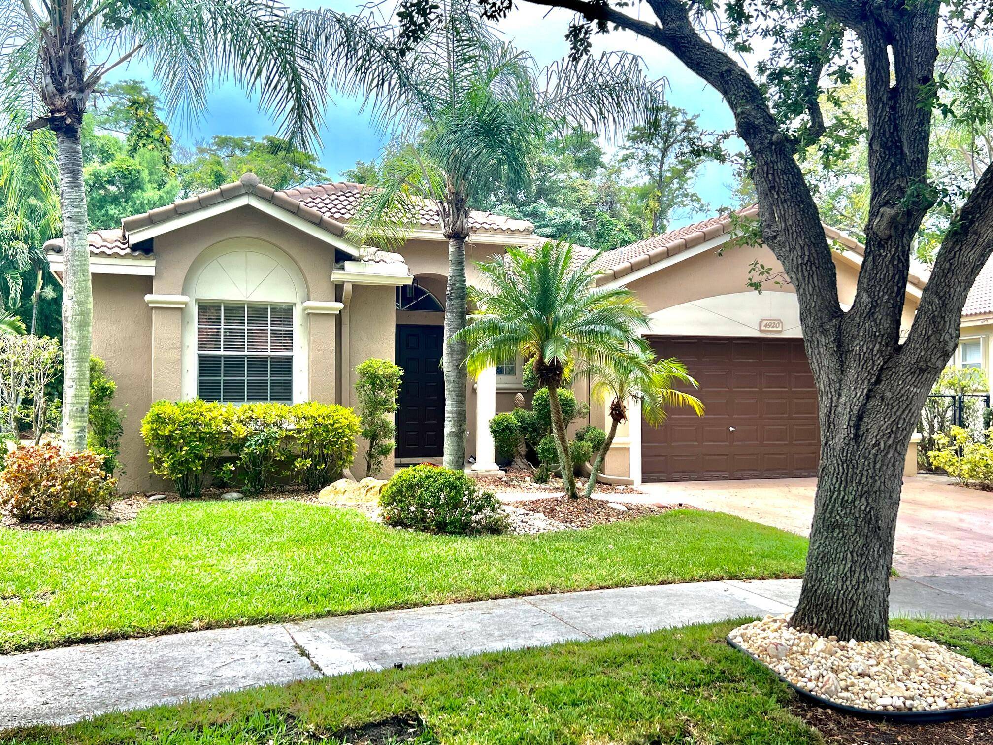 Welcome to your private oasis in one of South Florida's most desirable guard gated communities.