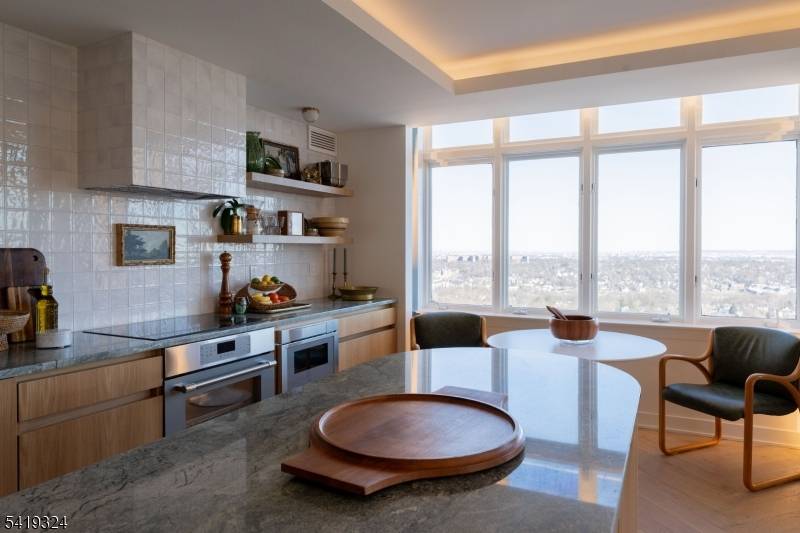 Perched at The Top, SOMA's premier luxury condominium, this fully renovated 3 bedroom residence showcases elevated design, exceptional craftsmanship, and sweeping NYC skyline views.