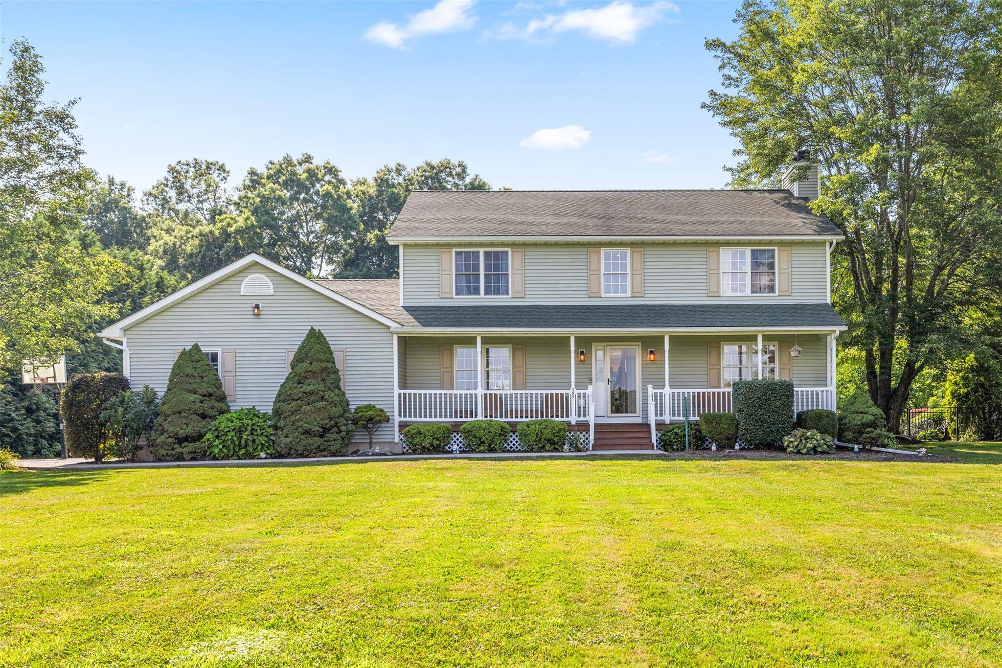 Welcome to this stunningly maintained 4 bedroom, 3 bathroom Colonial, gracefully nestled on 2.