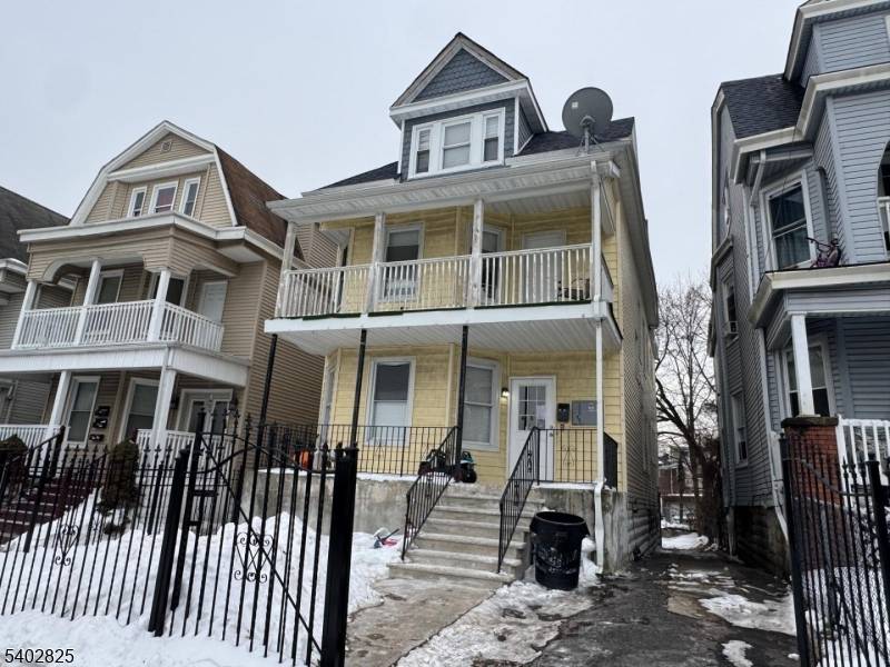 Recently Renovated Three Family Home Located in Front of Paul Robeson Staduim near Garden State Parkway Brick Train Station Features Hardwood Floors, Central Air Parking