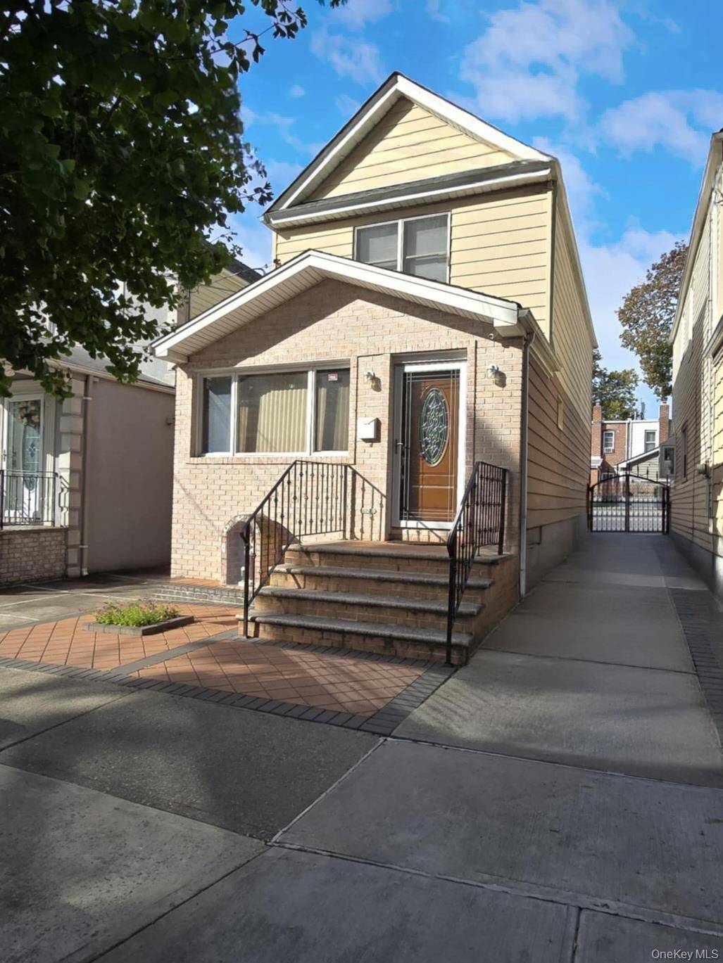 Welcome to this beautifully maintained Ozone Park colonial home, offering a versatile layout and modern comforts.