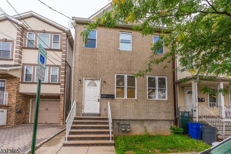 Welcome to this beautifully renovated two family home, complete with a finished attic and basement !