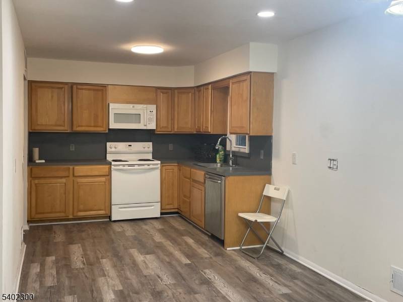 WOW GREAT LOCATION GREAT PRICE, LIGHT AND BRIGHT RANCH WITH HARDWOOD FLOORS, LARGE OPEN KITCHEN, FINISHED BASEMENT WITH NEWER VINYL FLOORING, FRESHLY PAINTED AND READY FOR IMMEDIATE OCCUPANCY,