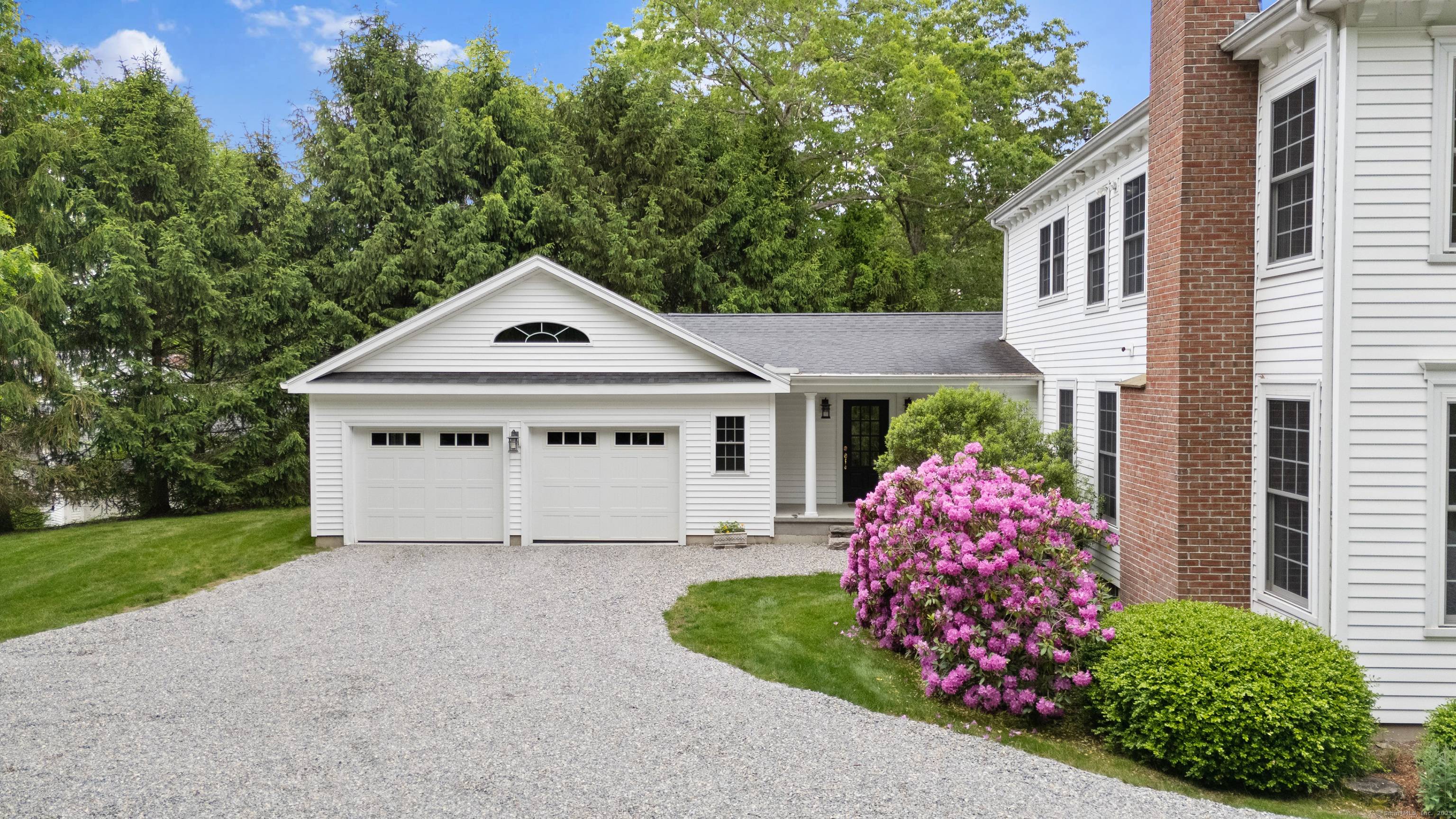 Welcome to this beautiful and spacious Federal style home, privately sited on 4.