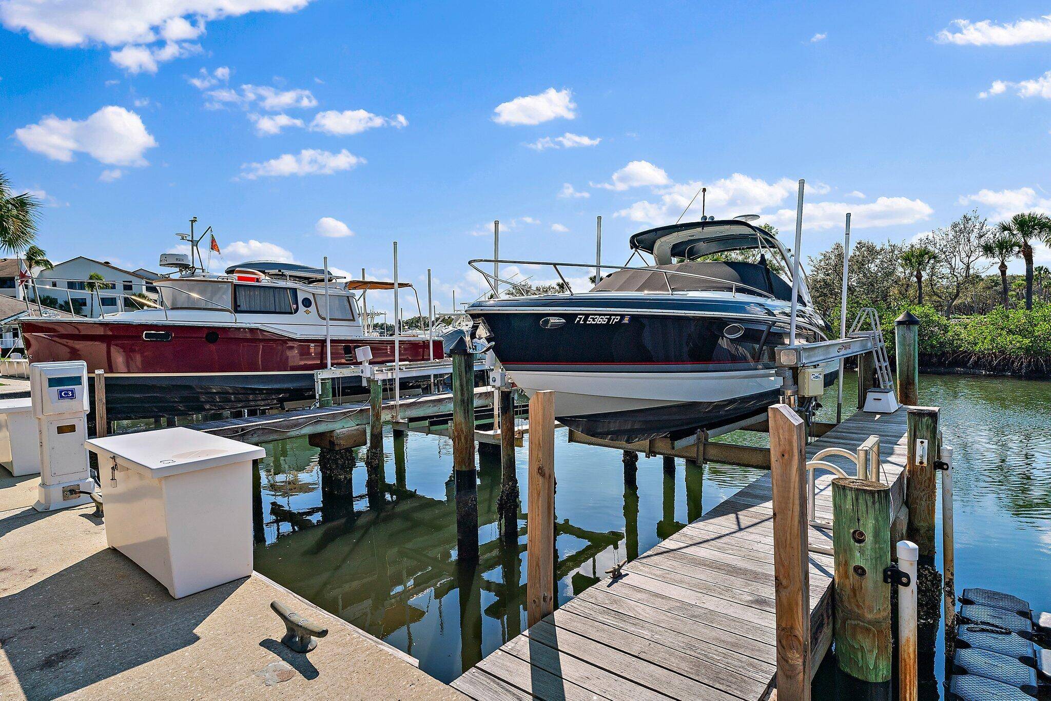 Deeded boat slip with 20, 000 lb lift, dock box, water and electric service, and no fixed bridges for up to a 34' boat.