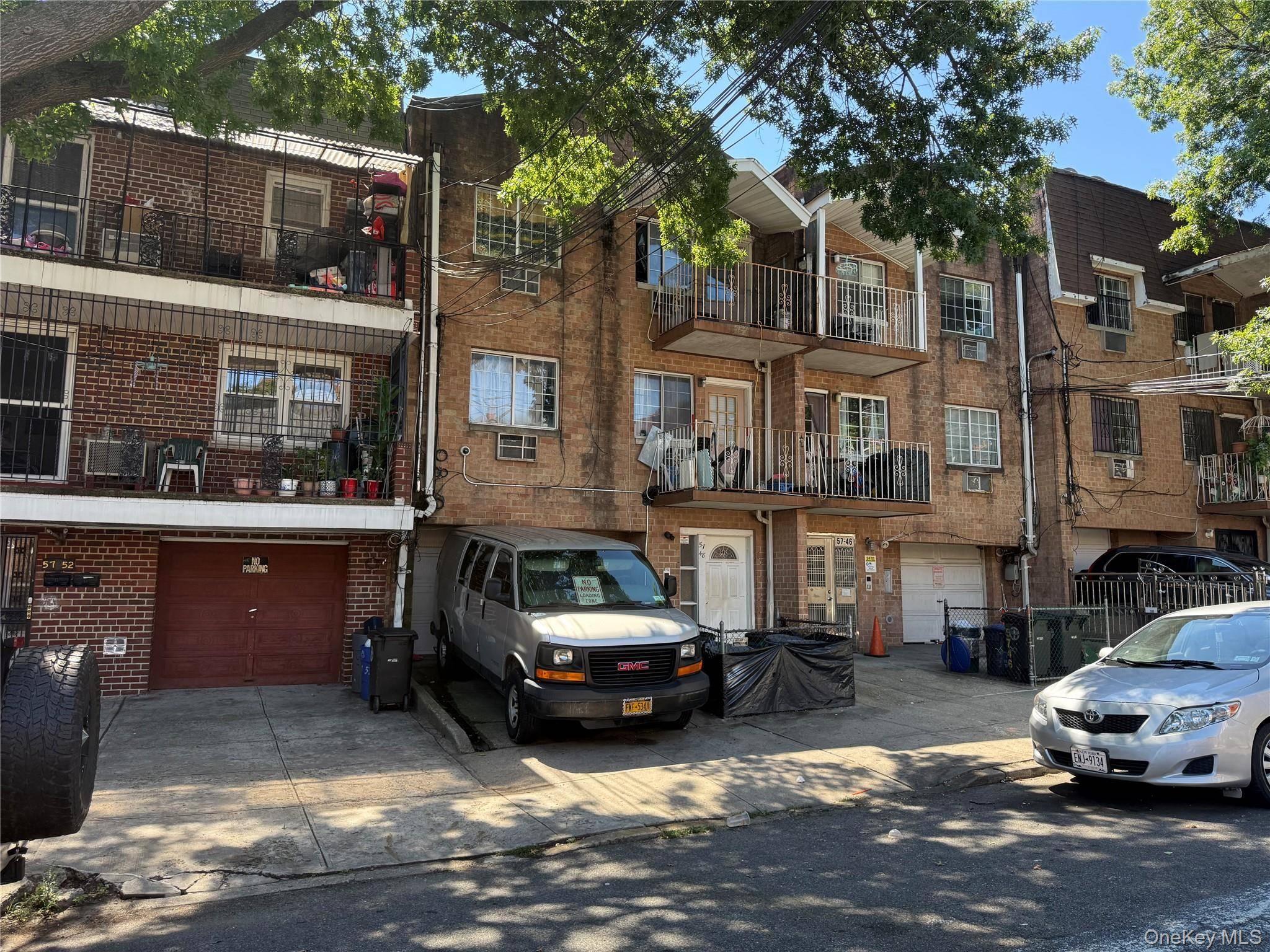 Attached brick five family house.
