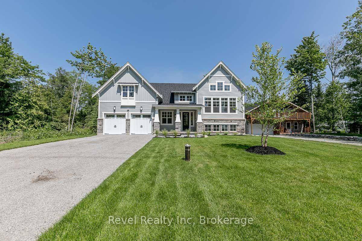 A Rare Gem in Tiny Where Craftsmanship Meets Coastal Living Welcome to one of the most beautiful homes currently on the market in Tiny Township a stunning custom built estate ...