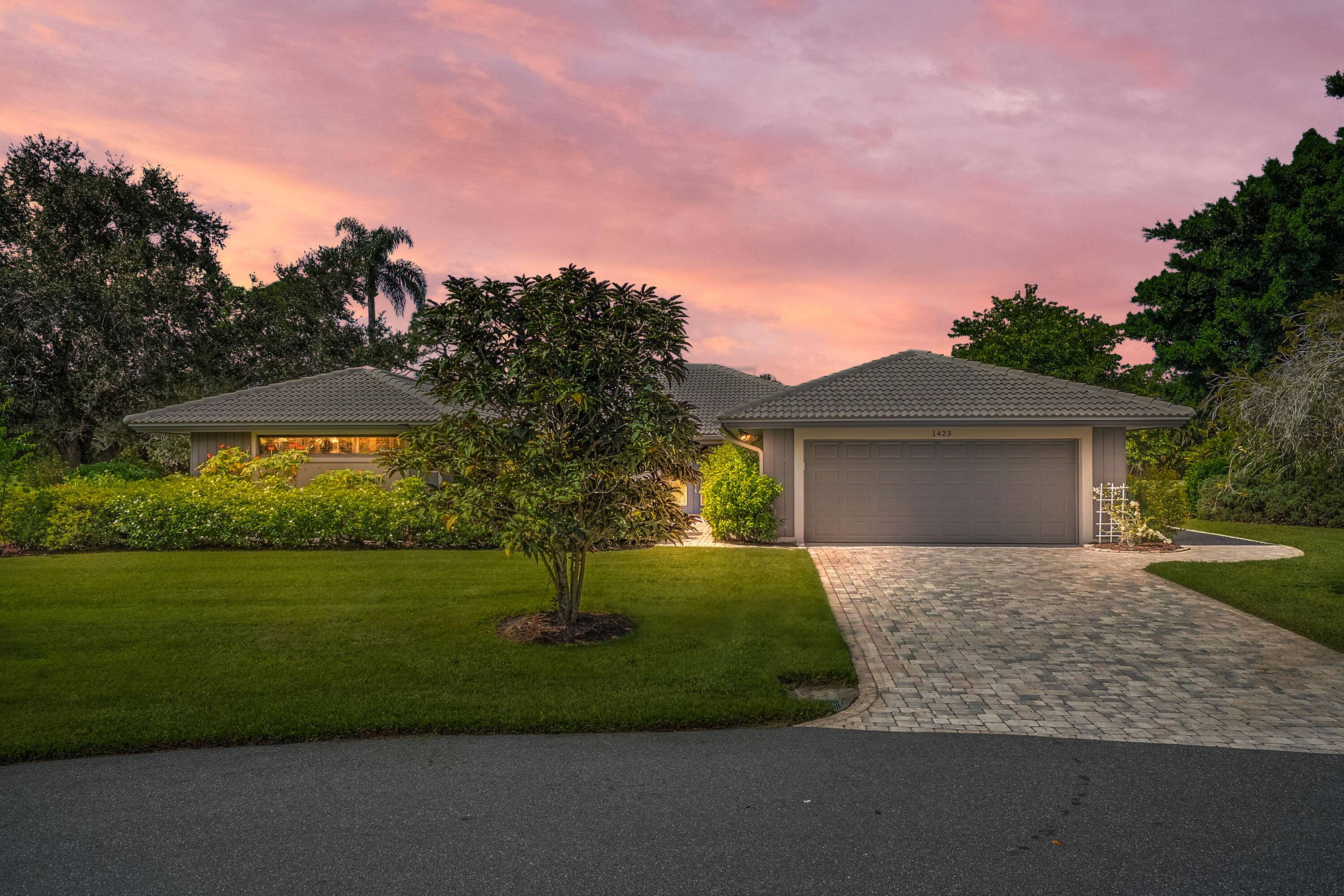 Tucked away on a private cul de sac, this beautiful home sits on an oversized lot and comes with impact windows for peace of mind.