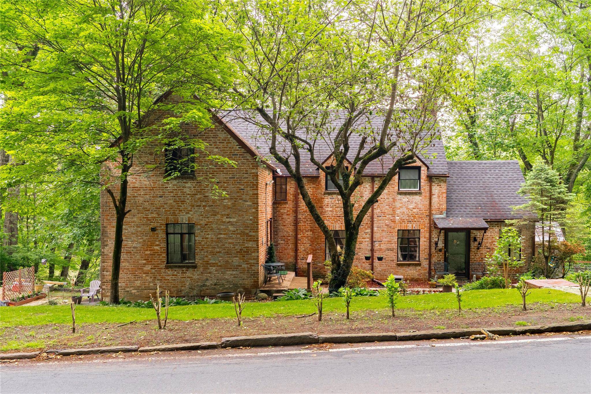 Rare opportunity to own a unique brick Tudor on a spacious 0.