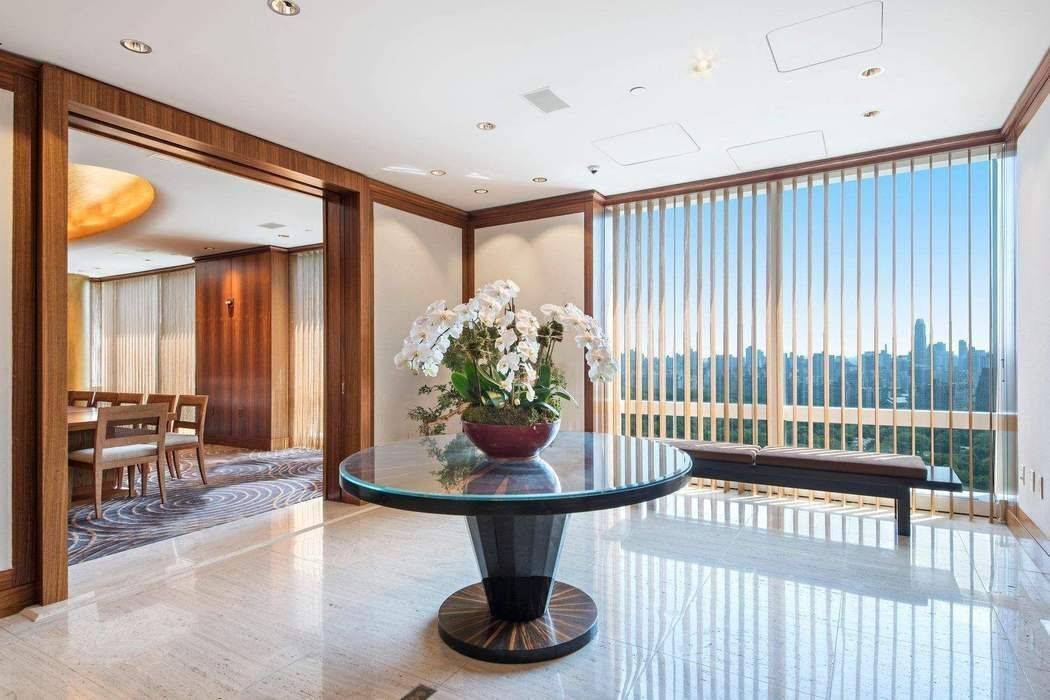 This dramatic transitional floor apartment is located high above Central Park on the 75th floor at 25 Columbus Circle.