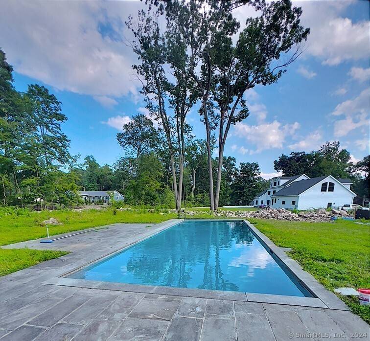 Welcome to 113 Woodbrook Dr, a beautifully updated and meticulously maintained colonial home in the heart of Stamford, CT.