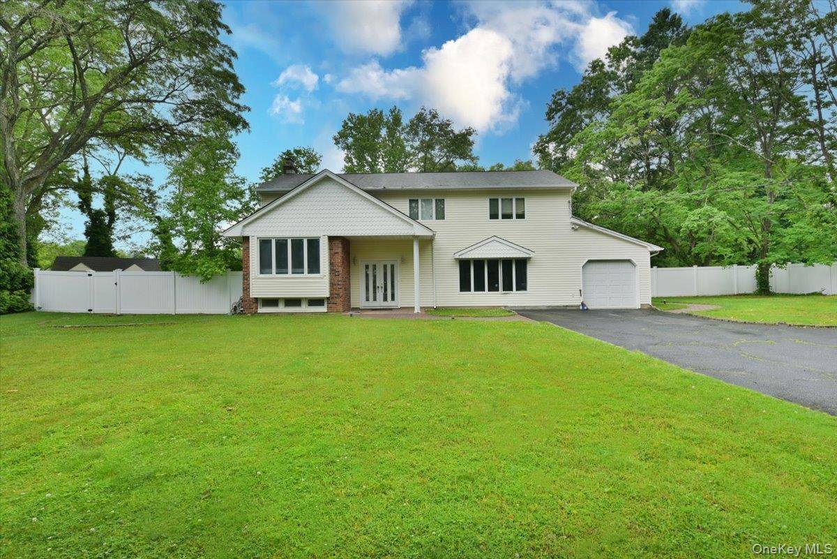 Tucked away on a quiet cul de sac, this charming Colonial sits on a full acre of flat, beautifully maintained land offering both privacy and space to spread out.