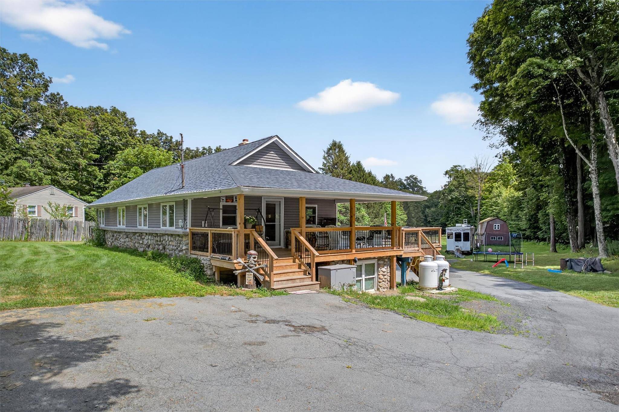 Welcome to a truly unique and versatile property that offers the perfect blend of comfort, functionality, and income potential set on nearly 3 acres of land to enjoy !
