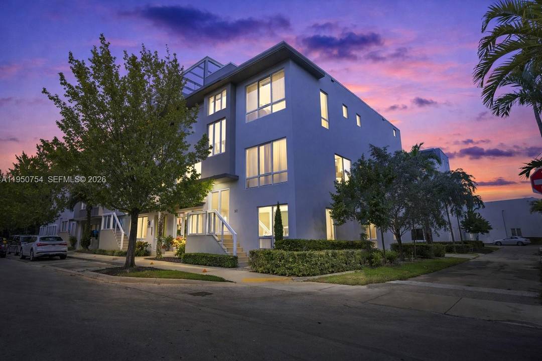 Corner tri level townhouse with private elevator in the highly sought after Landmark at Doral community.