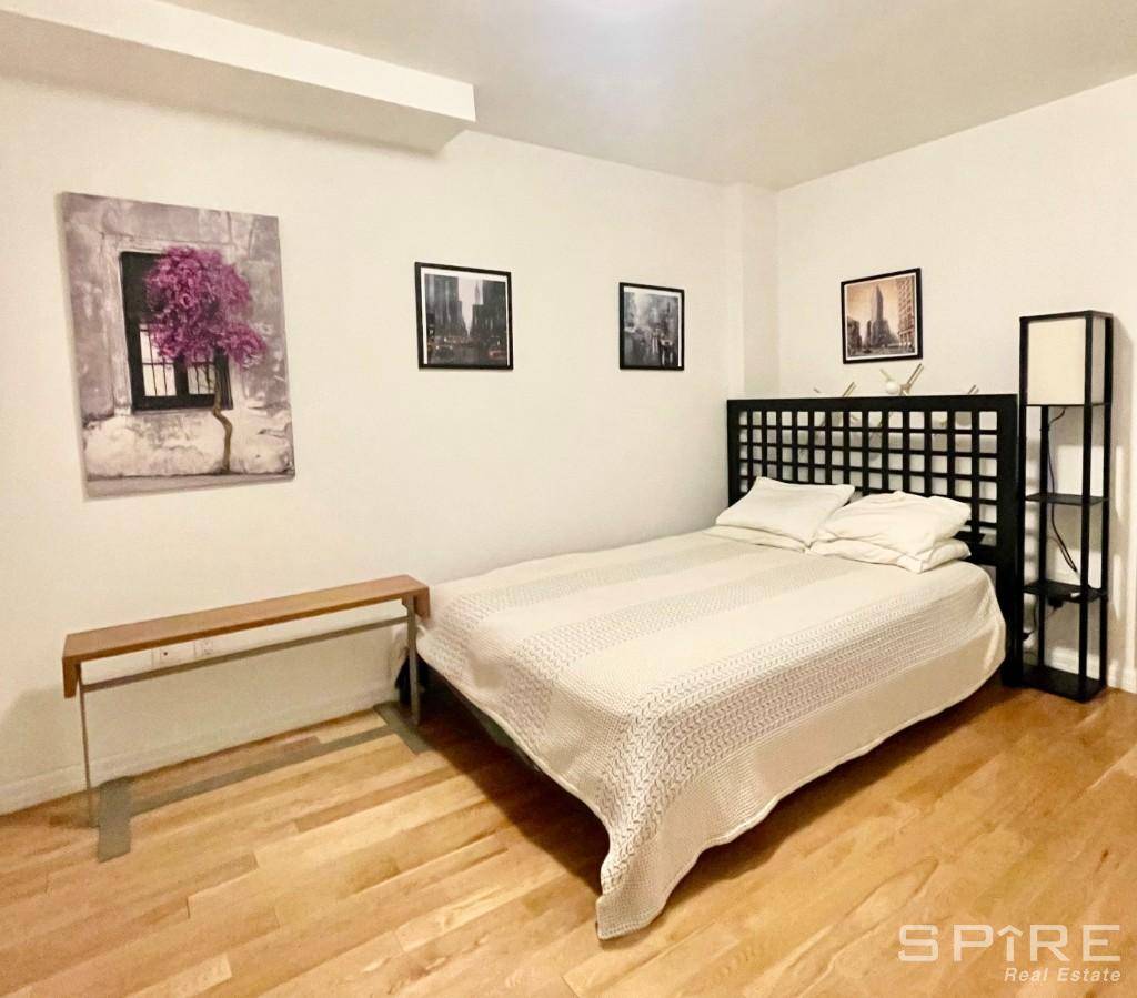Huge luxury condo loft apartment 660sf The Alcove easily fits a Queen size bed and this space has its own closet.