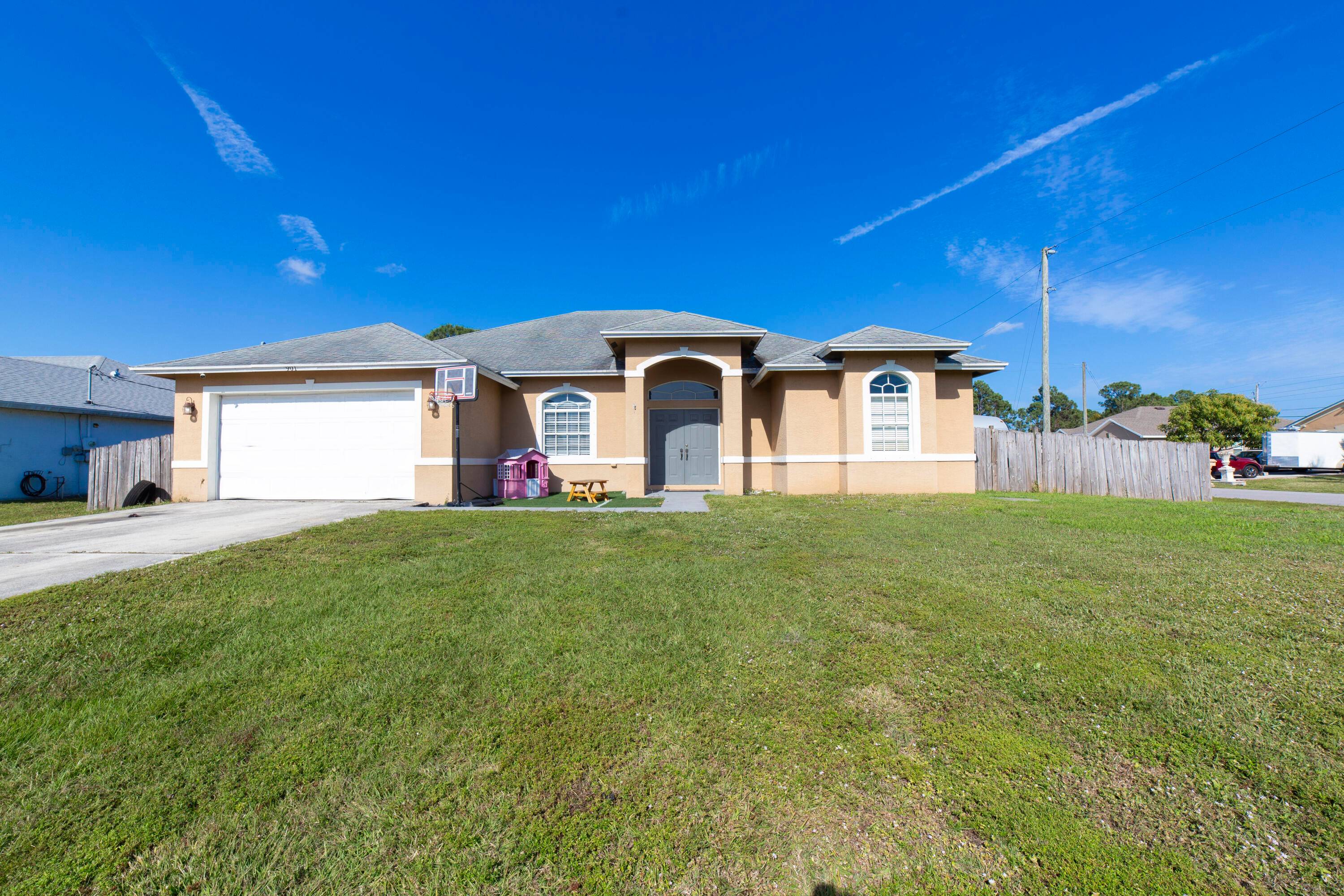 This spacious and charming rustic style home features a grand entry with double swinging doors, welcoming you into a bright and open concept design.