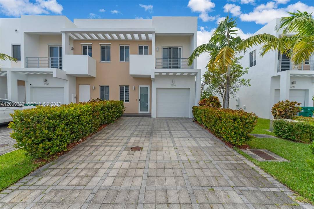 Stunning corner modern townhome offering sleek design, premium upgrades, and exceptional indoor outdoor living.