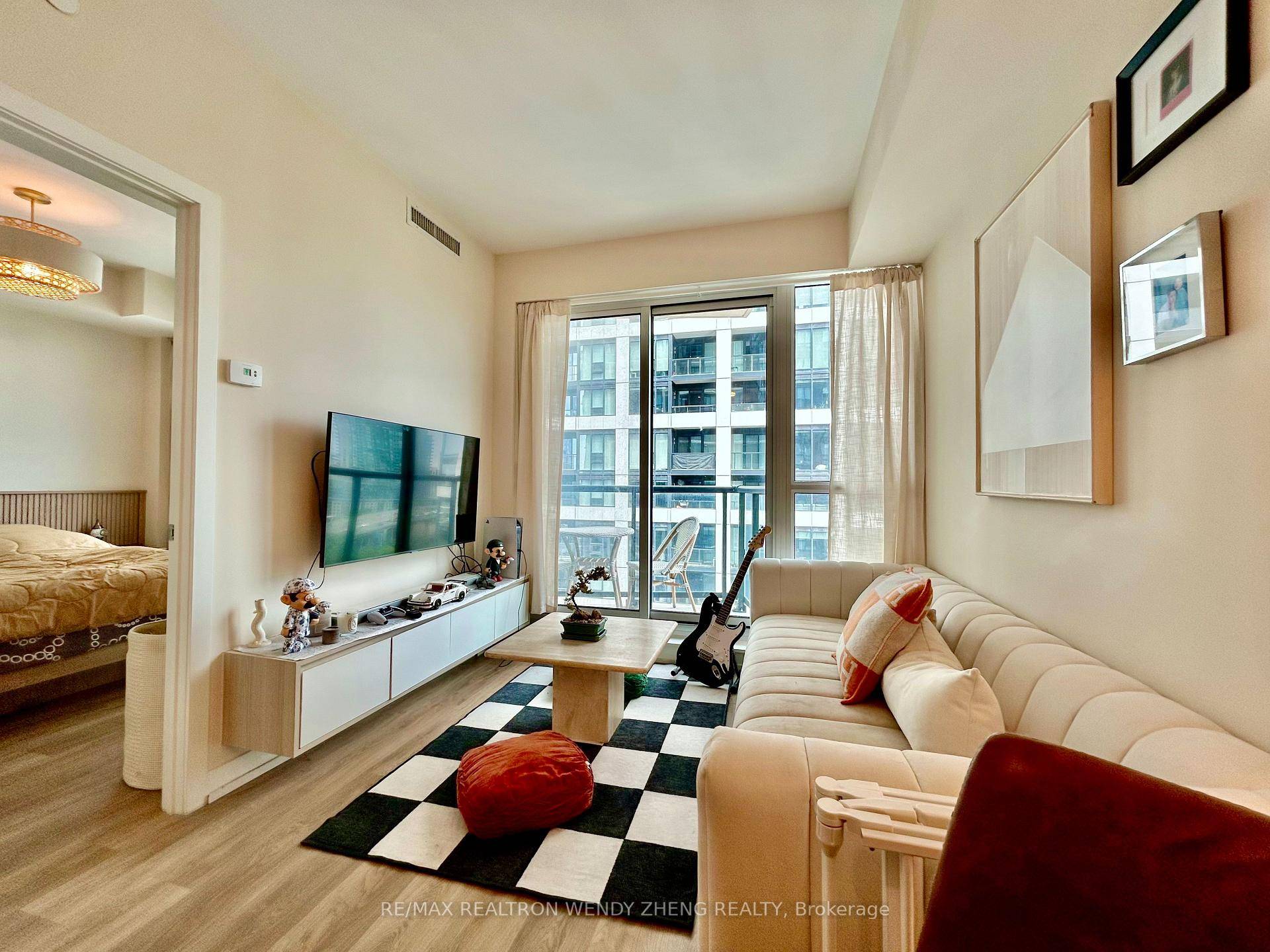 Step into this immaculate, condo at Liberty Central by the Lake II, where modern elegance meets lakeside tranquility.
