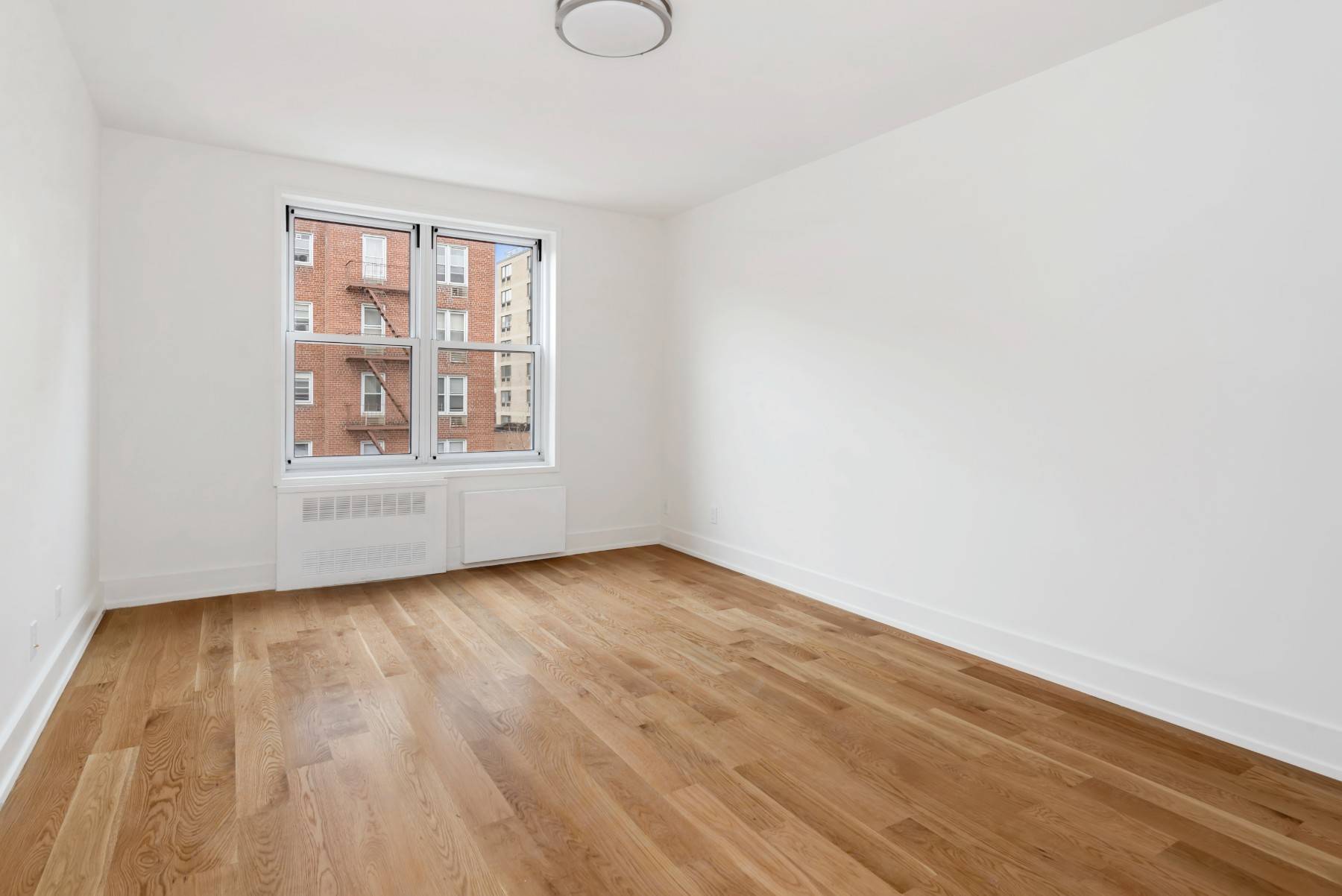 This modern, newly renovated alcove studio features new oak hardwood floors, a spacious living room, separate kitchen with stainless steel appliances and a glass tiled back splash, sparkling new bathroom, ...