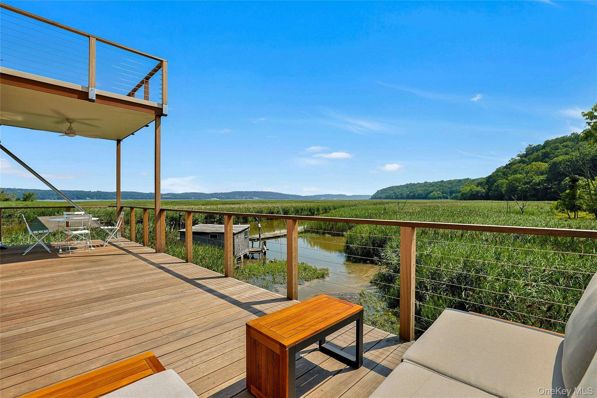 PIERMONT MARSHOUSE Floating above a natural sanctuary with sweeping, ever changing views of the Piermont Marsh and Hudson River, this architectural jewel feels like stepping into a living Ansel Adams ...